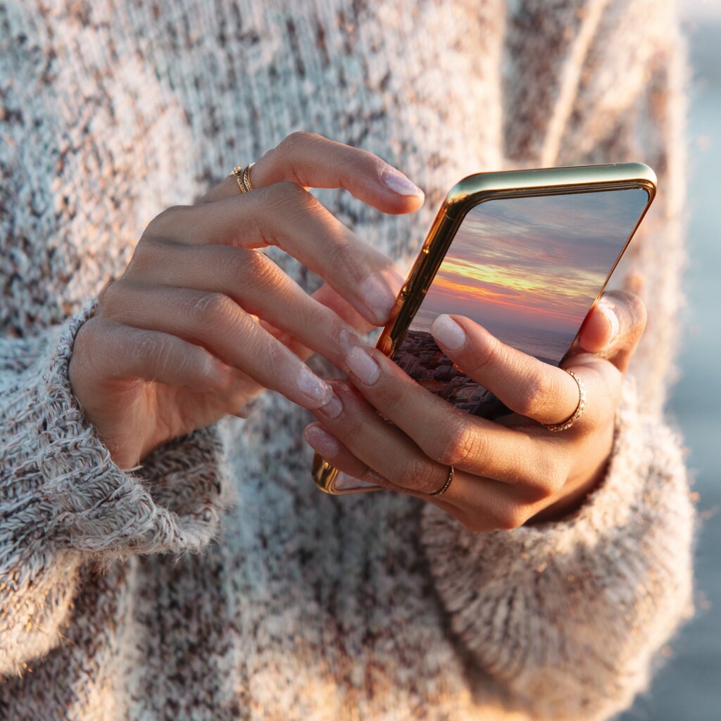 Woman checking her phone trying to find out if someone was in a car accident in Mississippi